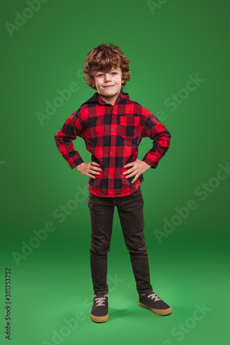 Cheerful kid in checkered shirt
