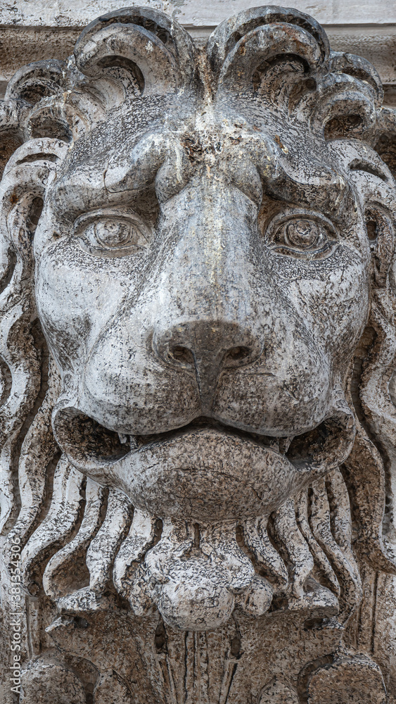 Ancient decoration element of scary lion head at roof of Basilica San Marco and Doge Palace  in Venice, Italy
