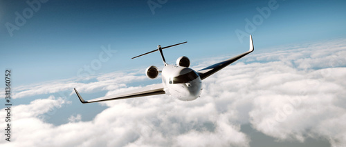 Luxury private business jet in flight over a cloud covered background. Realistic 3d render of silver luxury generic design private airplane flying over the earth. Business travel concept.