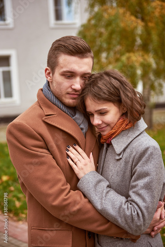 Young beautiful couple walking and hugging in the autumn park  © Elena Kharichkina