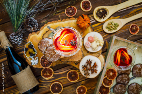christmas cookies and mulled wine on wooden background