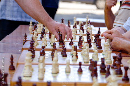 older people do a chess tournament. chess part closeup