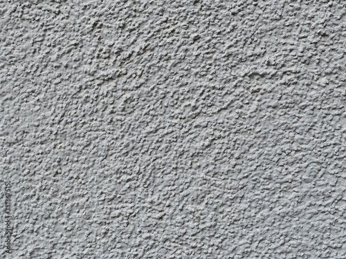 gray rough wall of a building close up - texture
