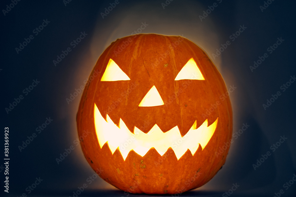 halloween pumpkin with light bulb and backlit scary zigzag muzzle. hedgehog. High quality photo halloween pumpkin with light bulb and backlit scary zigzag muzzle. hedgehog. High quality photo