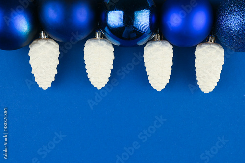snow cones with christmas balls on blue background