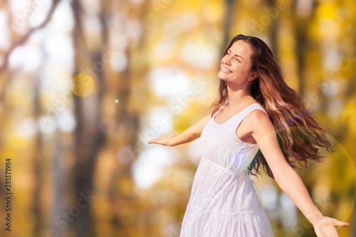 Young woman relaxing under sunset light