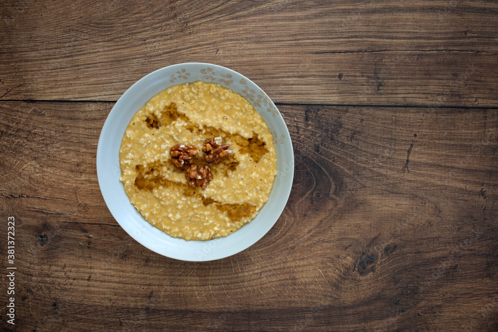 Pumpkin Spice Oatmeal on a Wooden Table Pumpkin Spice Oatmeal on a Wooden Table
