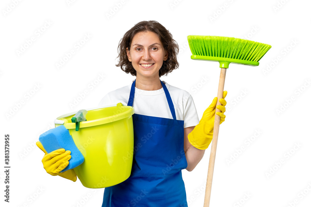 woman cleans the house. The woman is holding a mop and a bucket and gloves and a cleaning sponge. indoor cleaning concept. isolated woman cleans the house. The woman is holding a mop and a bucket and gloves and a cleaning sponge. indoor cleaning concept. isolated