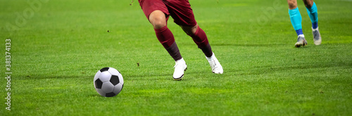 soccer game background player kicking football © Melinda Nagy