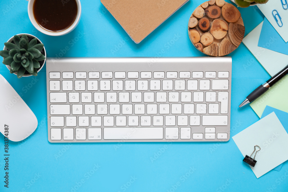 blue office desk background with smartphone with blank screen mockup, laptop computer, cup of coffee and supplies. Top view with copy space, flat lay. blue office desk background with smartphone with blank screen mockup, laptop computer, cup of coffee and supplies. Top view with copy space, flat lay.