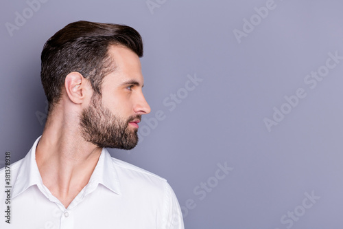 Close-up profile side view portrait of his he nice attractive virile brunet guy groomed unshaven beard copy empty blank place space isolated over gray pastel color background