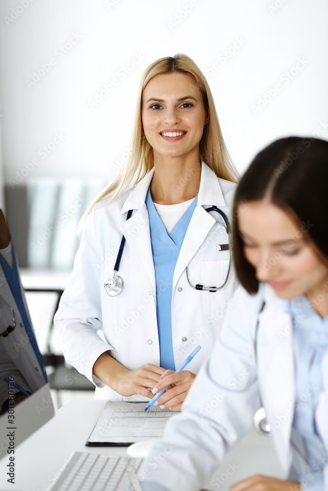 Unknown woman-doctor controls medication history record and medical exam results, close-up. Medicine concept Unknown woman-doctor controls medication history record and medical exam results, close-up. Medicine concept
