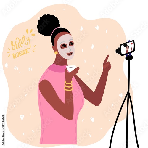 African black woman beauty blogger apply mask cream on face. makeup tutorials. Creating content and posting it on social media. online channel concept, female video 