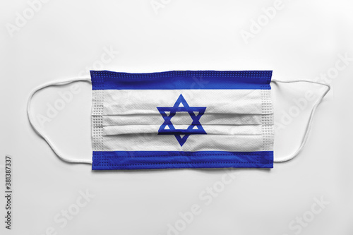 Face mask with Israel flag printed, on white background, isolated