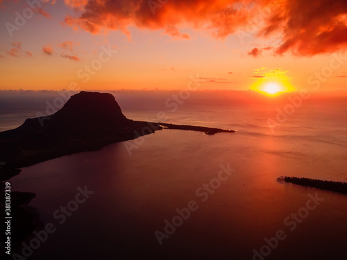 Sunset and Le Morn mountain with ocean in Mauritius island. Aerial view