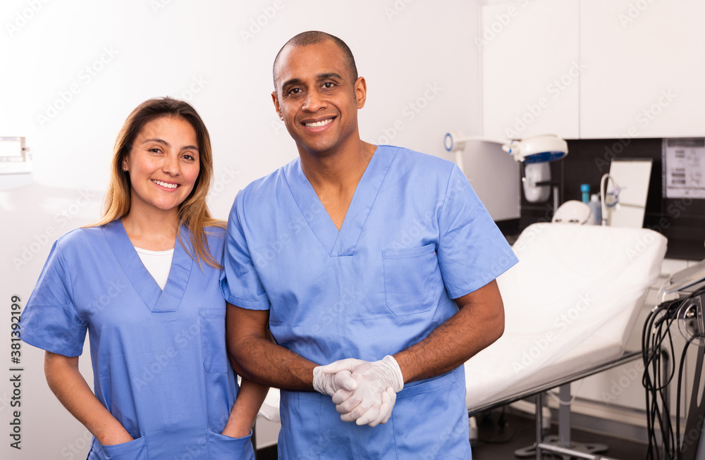 Obraz premium Portrait of two successful professional Hispanic cosmeticians in modern medical esthetic office