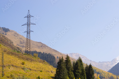 Power line tower high in the mountains in autumn.