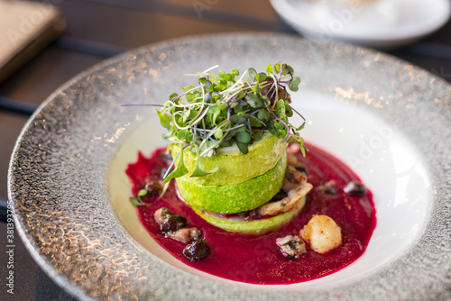 Grilled zucchini with sprouted radish, leaves gourmet cuisine