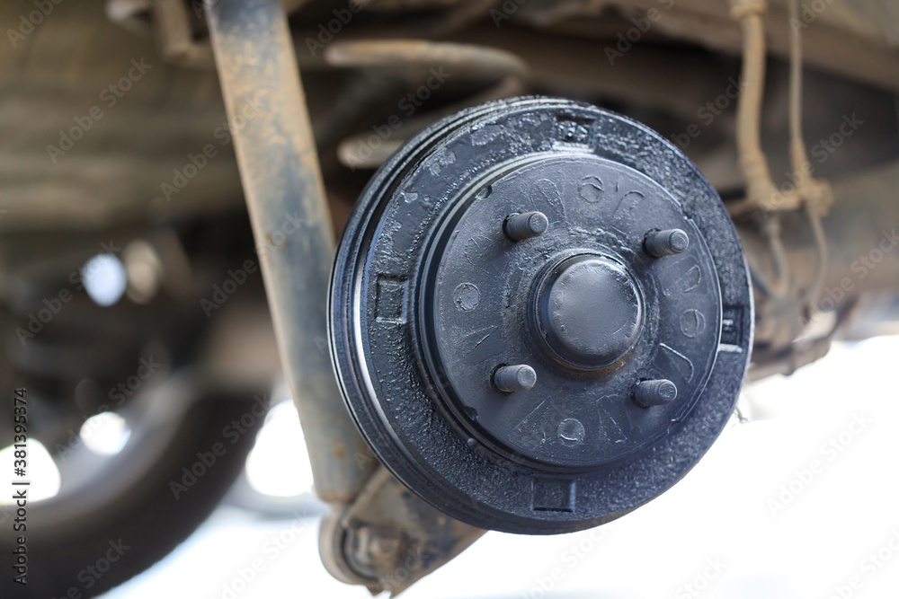 A rear hub of the car after removing a tire and wheel, maintaining a brake and wheel system, car jack-up for change a car wheel, Close-up shot