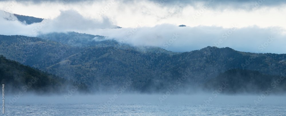 Obraz premium Foggy morning on the Yenisei River, Siberia. Panoramic view.