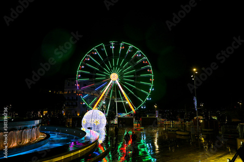 Colorful Ferris wheel at night