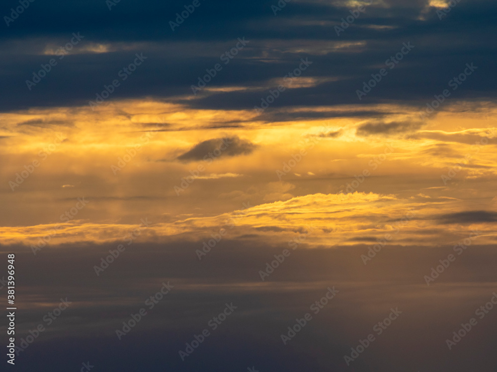 Colourful sunset with a lot of clouds and dramatic athmospere