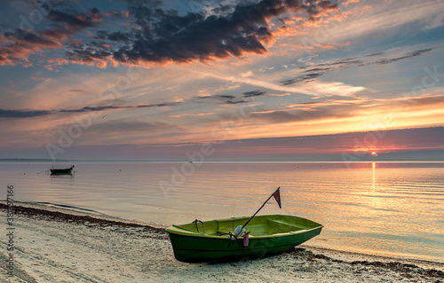 Coastal landscape with fishing boats, anchors and tackles near village of fis...