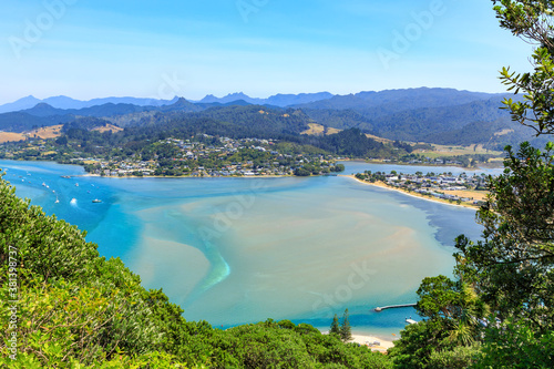 The sunny holiday town of Tairua on the Coromandel Peninsula, New Zealand. Panoramic view of the town and Tairua Harbour from Mount Paku