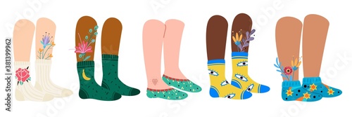 Legs in socks. Female and male feet wearing fashion socks with patterns and flowers. Stylish cotton footwear with bright ornaments vector doodle modern set of cute cozy accessories