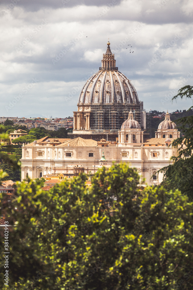 Obraz premium Dome of St. Peter in the Vatican city in Rome in Italy. Renovation works in the cathedral with scaffolding.
