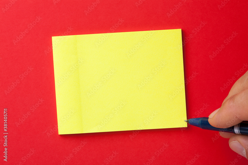Hand Holding Pen And Blank Note Hand Holding Pen And Blank Note