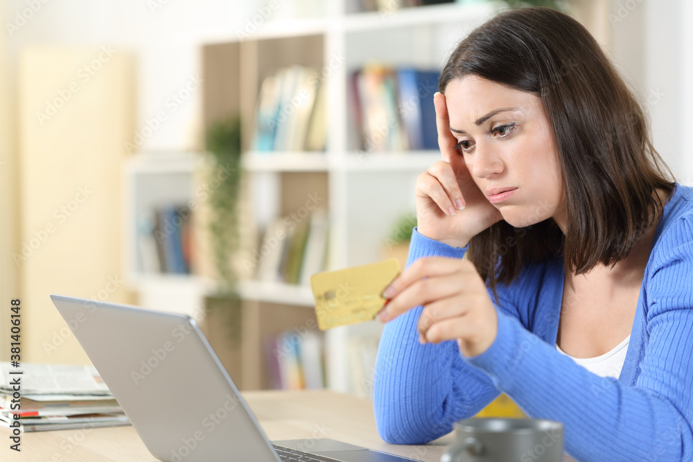 Worried woman having trouble paying with card Worried woman having trouble paying with card