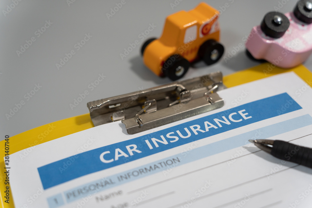 toy car, pen, document, car insurance concept on table