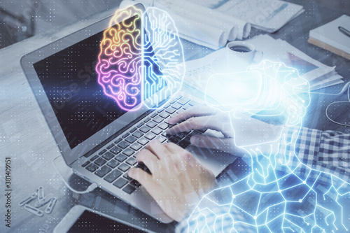 AR hologram with man working on computer on background. Augmented reality concept. Double exposure.
