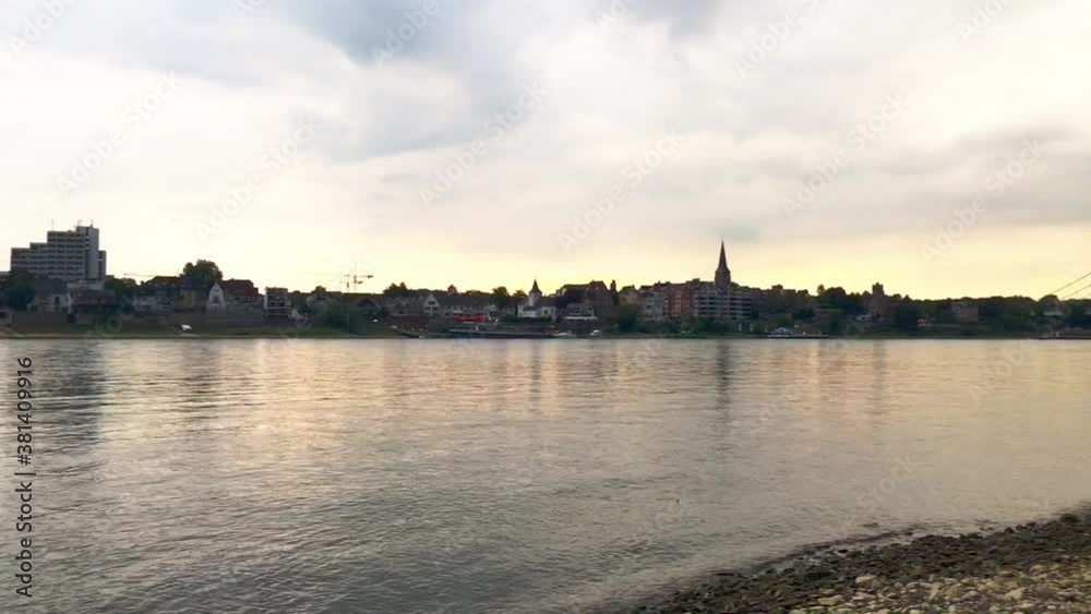 View over the rhine river in cologne during dawn with cloudy sky View over the rhine river in cologne during dawn with cloudy sky