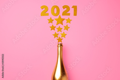 Champagne bottle with confetti flat lay top view