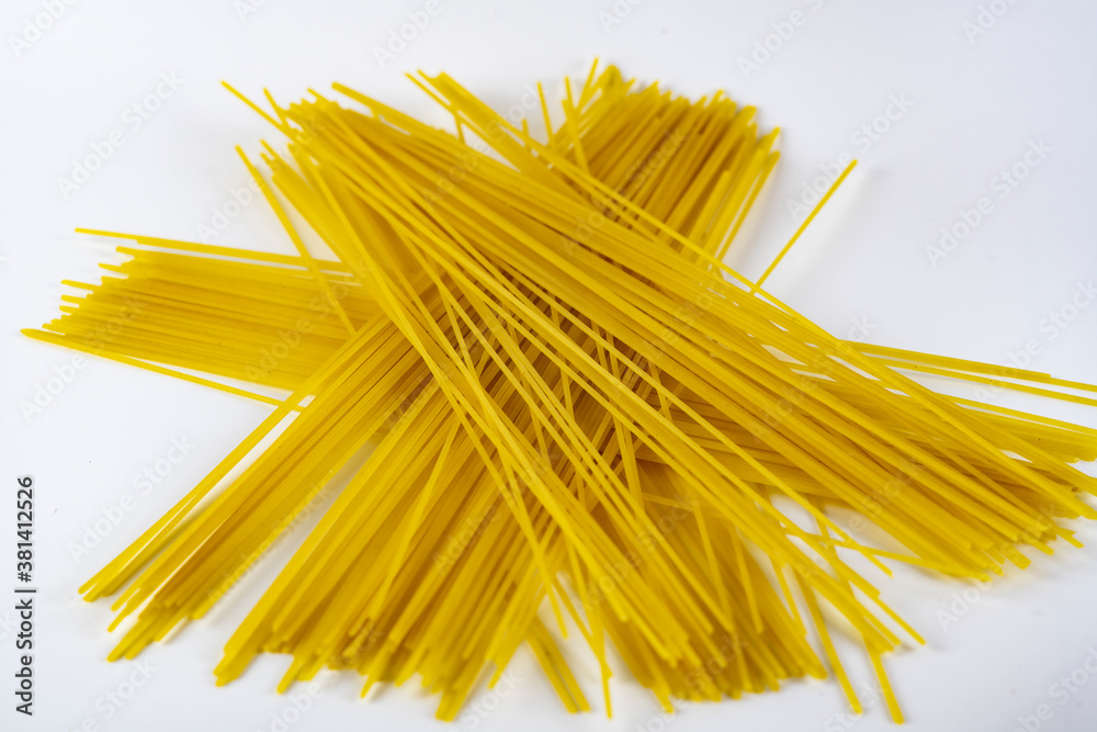 Long spaghetti on a white plate. Long spaghetti on a white plate.