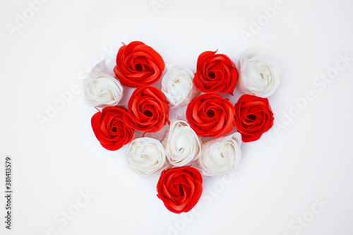 heart of roses on white background  flower heads layout  white and red roses  free space  mock up for design