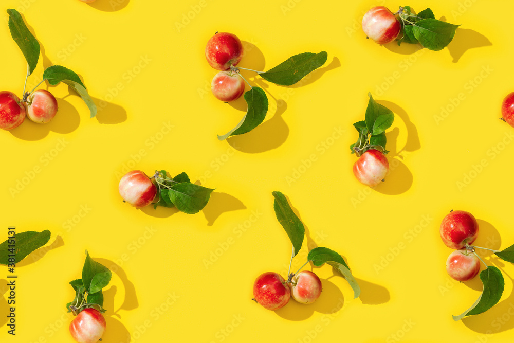 Seamless creative pattern from small red apples and green leaves with dark shadows. Seamless creative pattern from small red apples and green leaves with dark shadows.