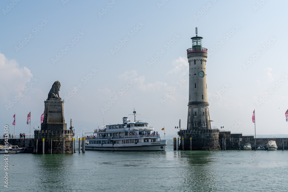passenger ship enters the protected harbor on Lindau Island on Lake Constance in Bavaria
