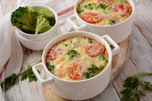 Broccoli, cheese and egg casserole in baking cocottes