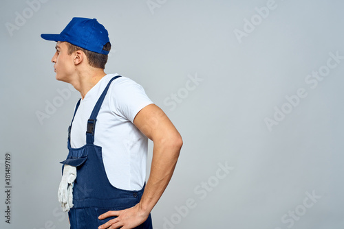 working man in uniform service lifestyle delivery service light background