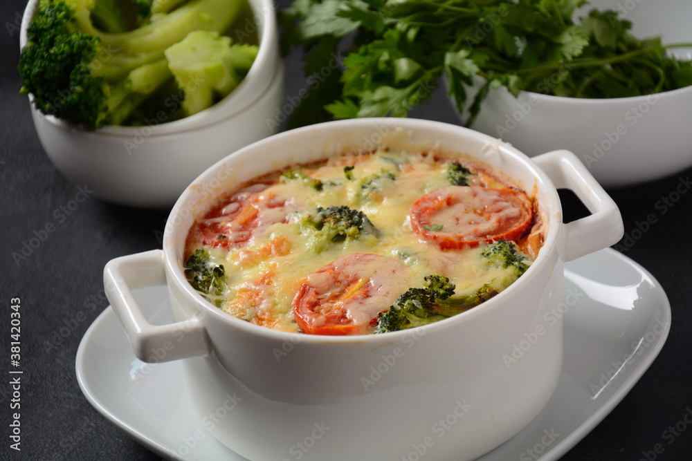Broccoli, cheese and egg casserole in baking cocottes Broccoli, cheese and egg casserole in baking cocottes