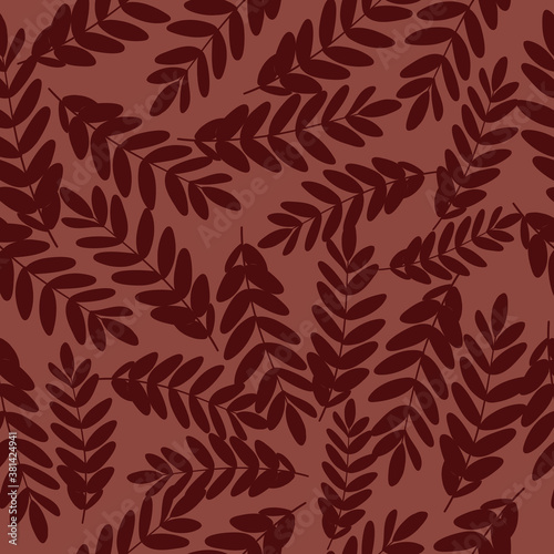 Vector seamless pattern with foliage in a red background.