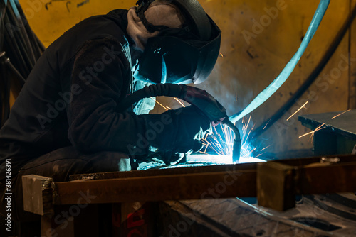 Welding work in an electromechanical workshop at a mechanical assembly site.