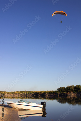 paragliding and boat on the river, Gualeguay, Entre Rios photo