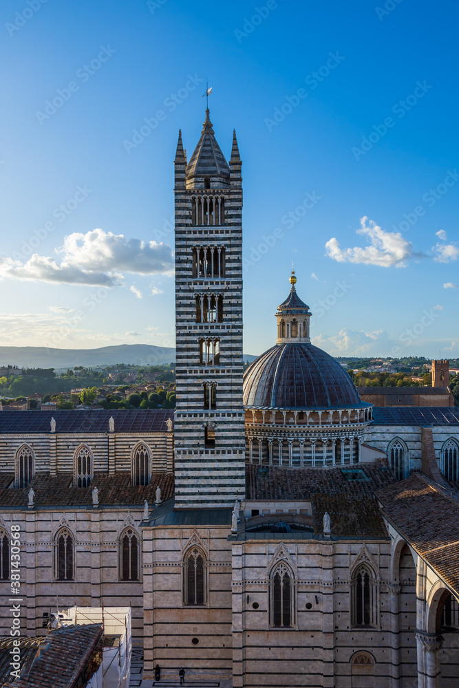 Siena, Tuscany, Italy: View of the Duomo di Siena (Siena Cathedral) taken from the Facciatone. Bell tower and dome with their world famous green and white marble stripes are visible