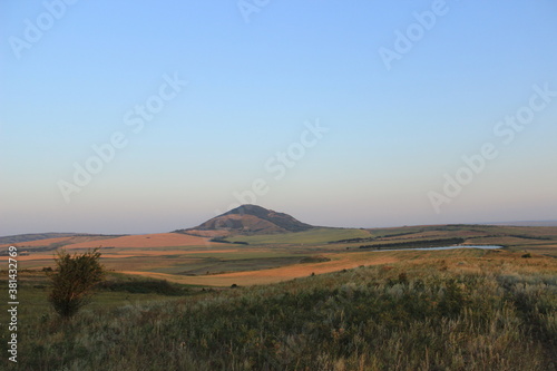 Summer natural landscape with mountains in the background. © Ольга Кожина