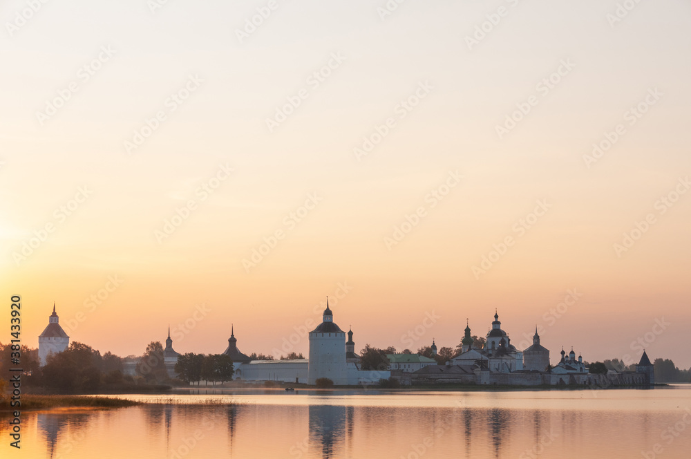 Landscape with a view of the old Orthodox monastery, dawn, fog