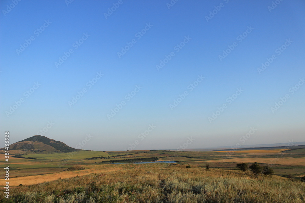 Summer natural landscape with mountains in the background. Summer natural landscape with mountains in the background.